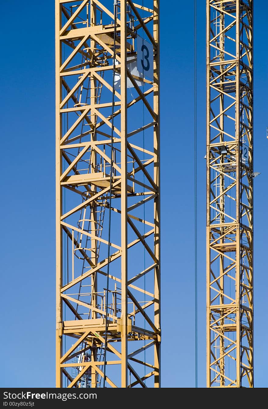 Two Cranes in the blue sky