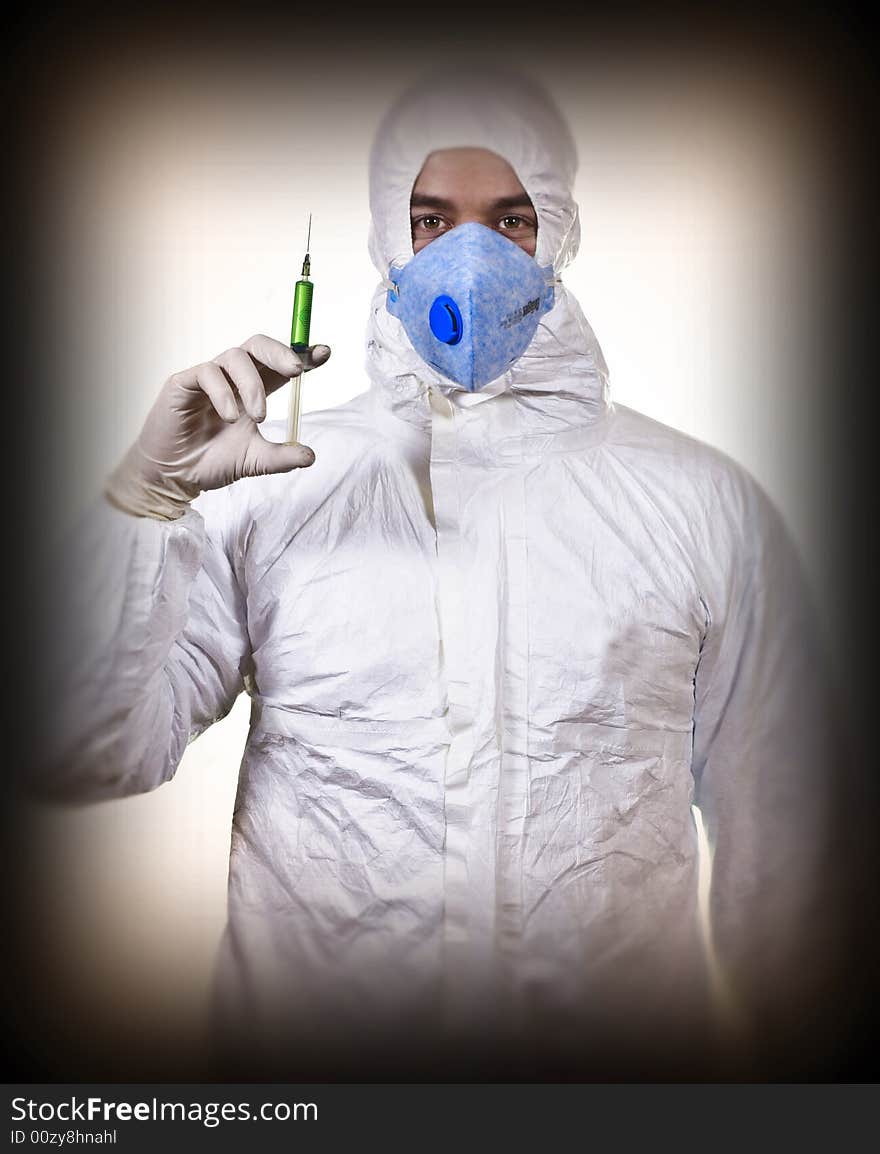 Man wear protechion clothes and hol syringe background