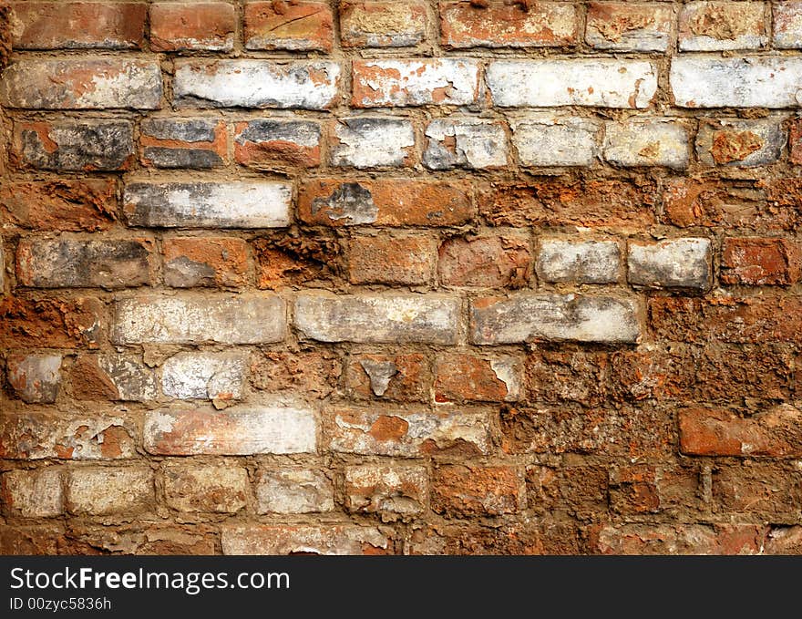 Fragment of old brick wall with gray stucco. Fragment of old brick wall with gray stucco