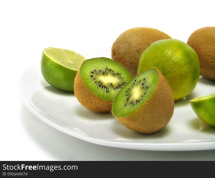 Plate of kiwis and limes