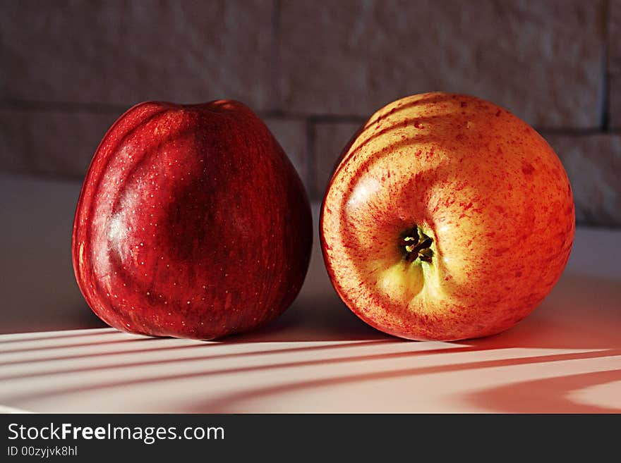 Two apples on a sunlight