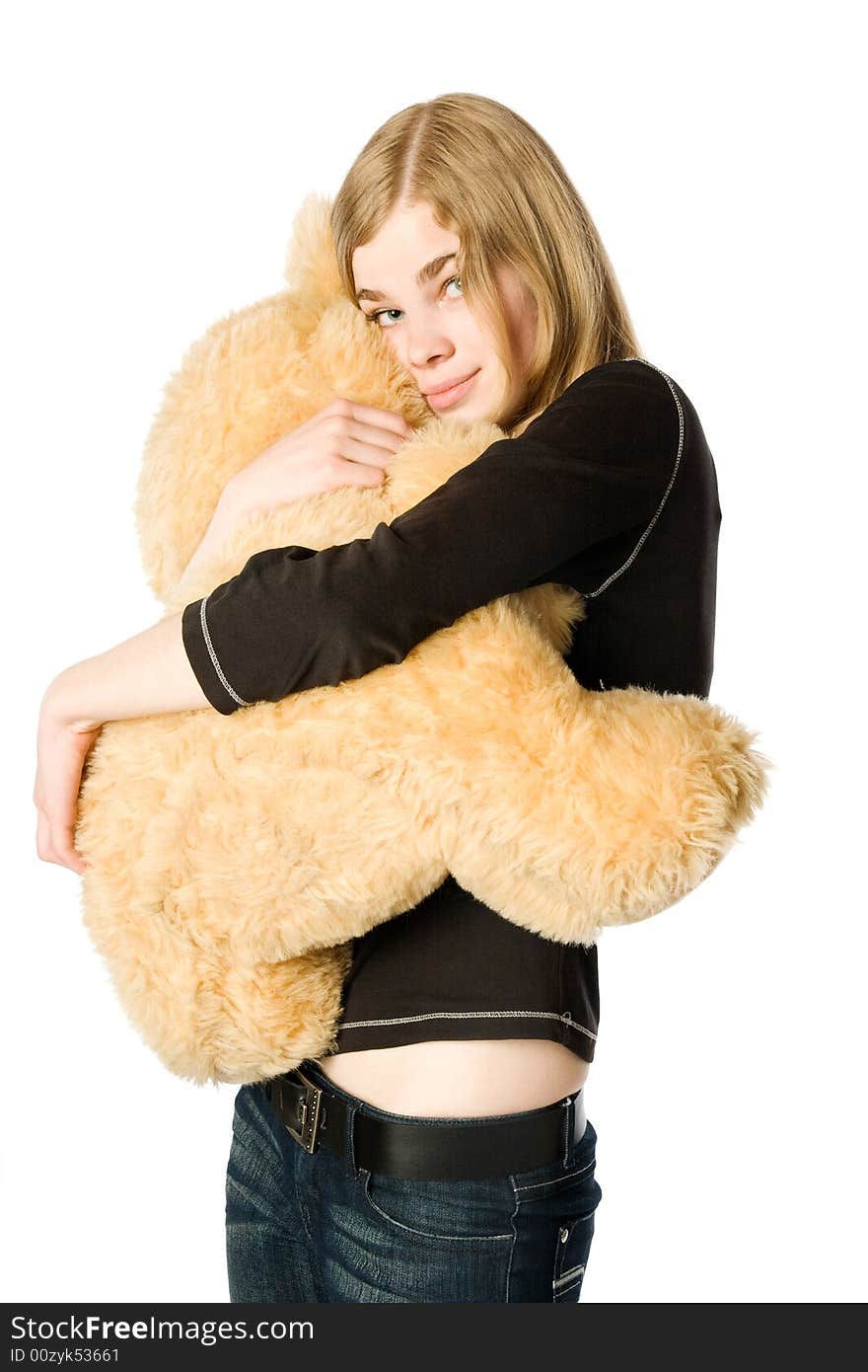 Young girl hugging a Teddy bear, isolated. Young girl hugging a Teddy bear, isolated