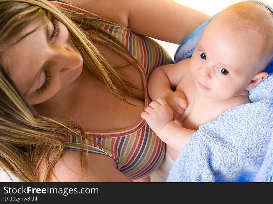 Mother's love. Cute baby 2 month with mother.