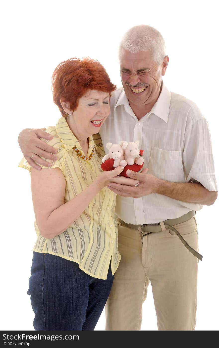 Seniou couple with toy in studio on white background. Seniou couple with toy in studio on white background