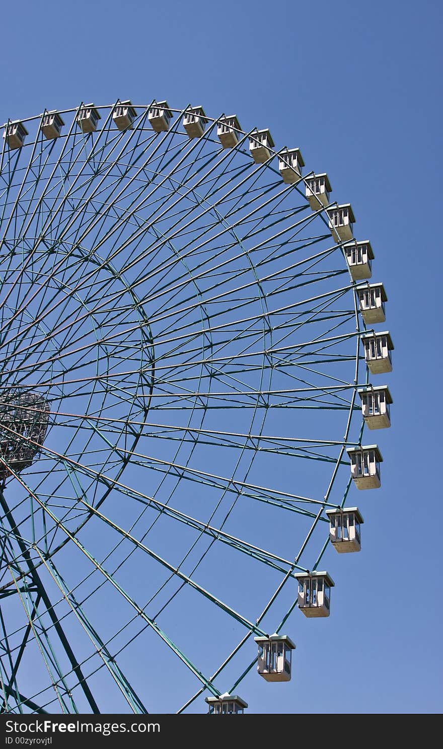 Ferris wheel with blue sky background