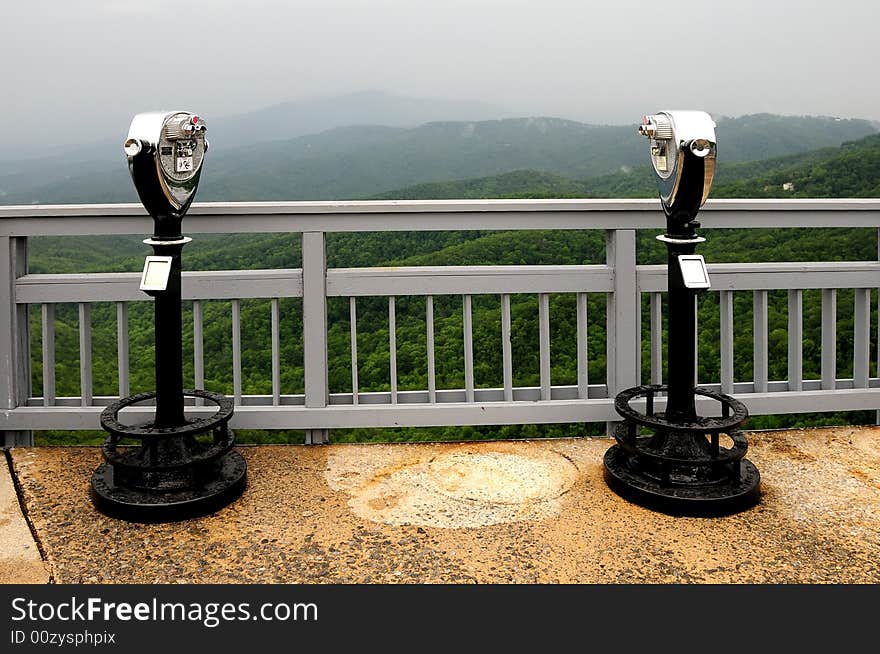 A coin operated binocular for viewing a landscape - face shaped. A coin operated binocular for viewing a landscape - face shaped.