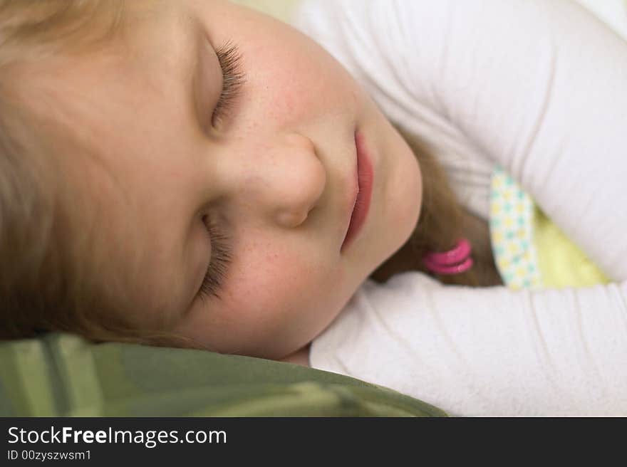 Sleeping young girl in white blouse. Sleeping young girl in white blouse