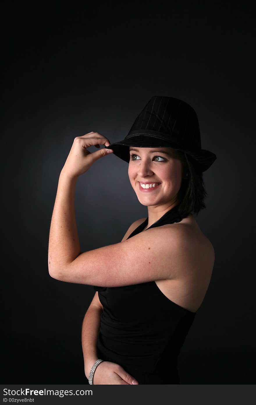 Cute teenage girl in black dress and hat. Cute teenage girl in black dress and hat