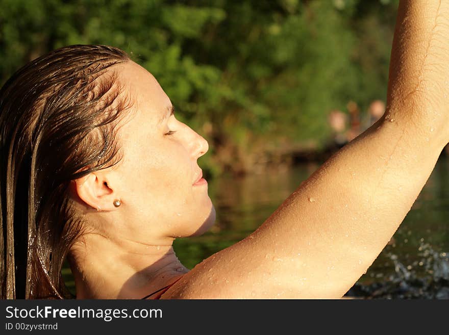 Woman with Wet Hairs in Water