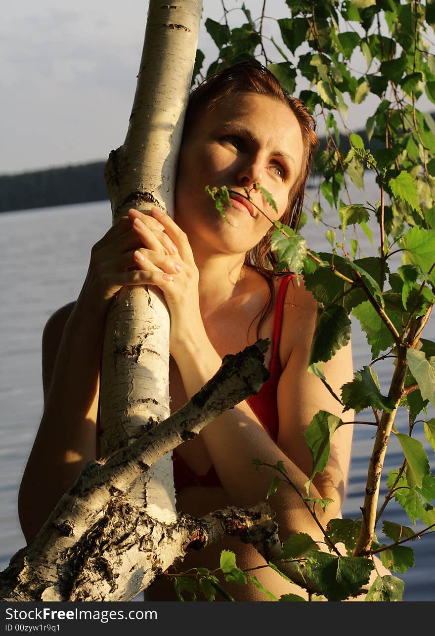 Woman Smile by Tree and Leaves in Water. Woman Smile by Tree and Leaves in Water