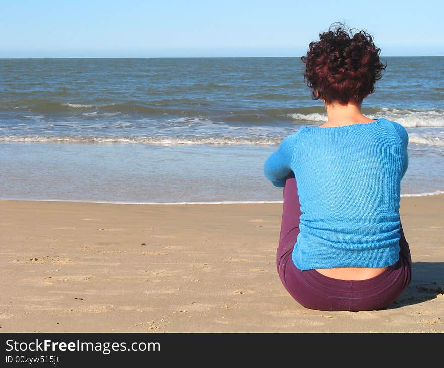 She is in silence looking the sea. She is in silence looking the sea.