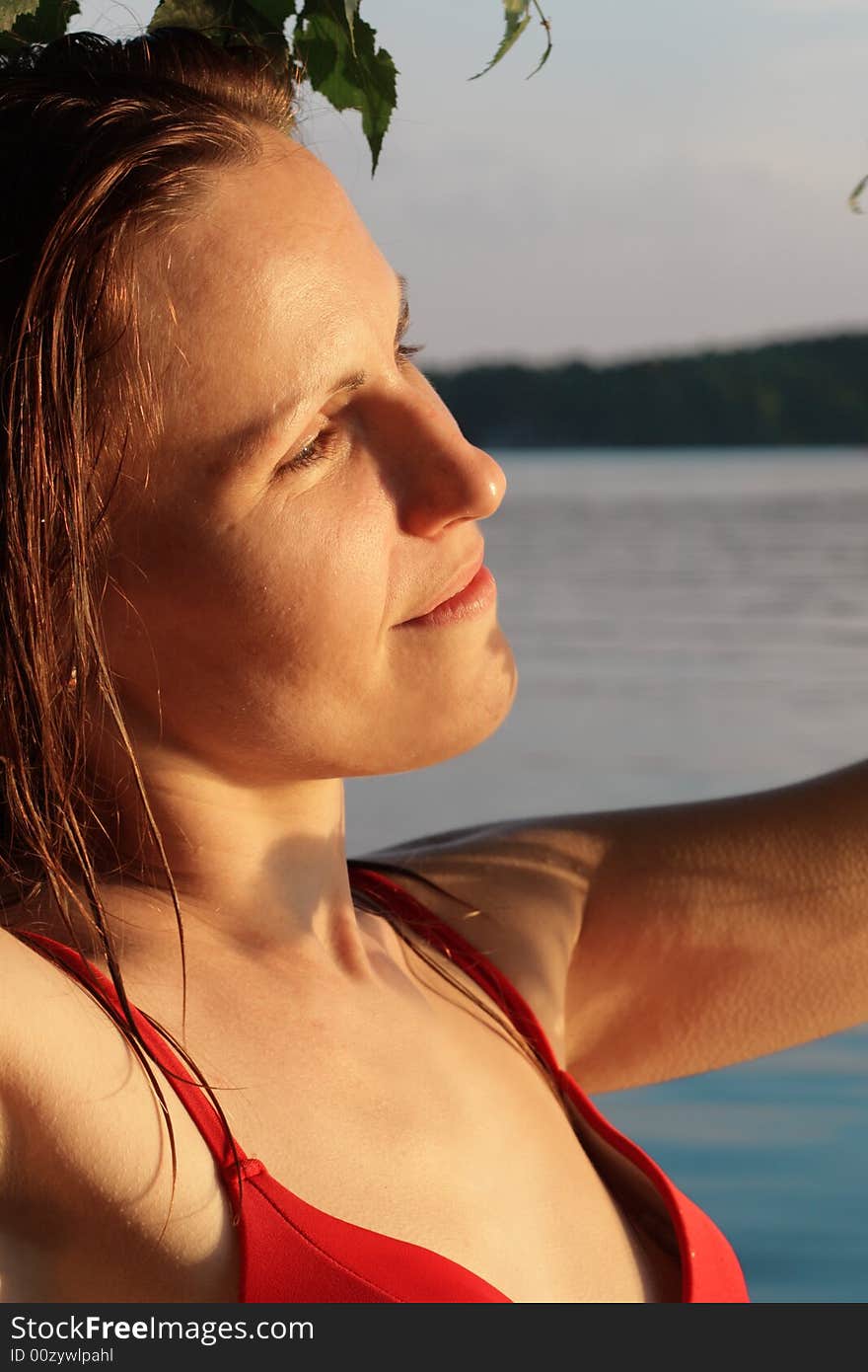 Woman Smile by Tree and Leaves in Water. Woman Smile by Tree and Leaves in Water