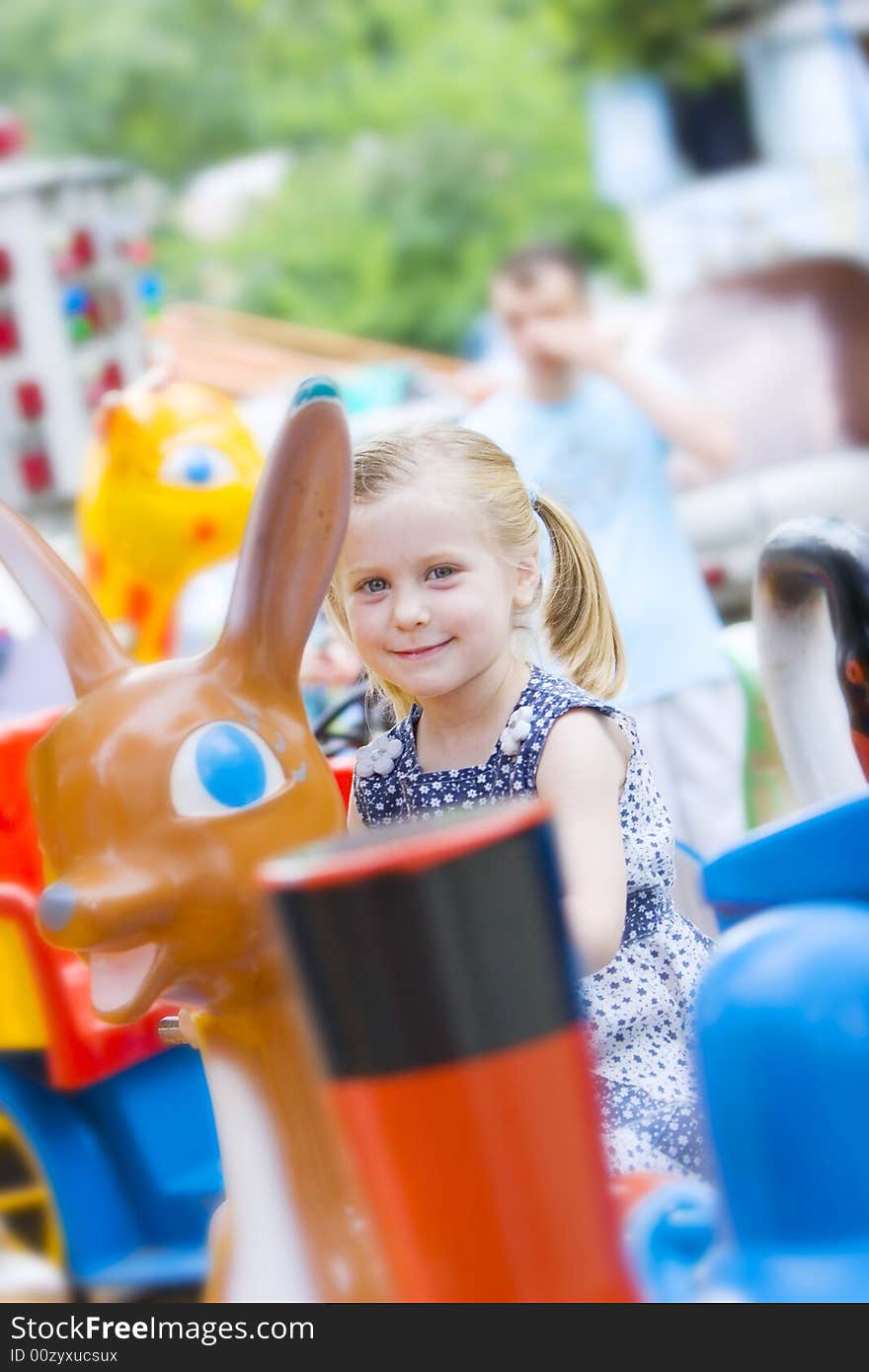 Little cute girl having fun in park