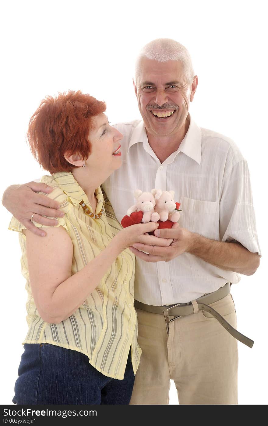 Seniou couple with toy in studio on white background. Seniou couple with toy in studio on white background