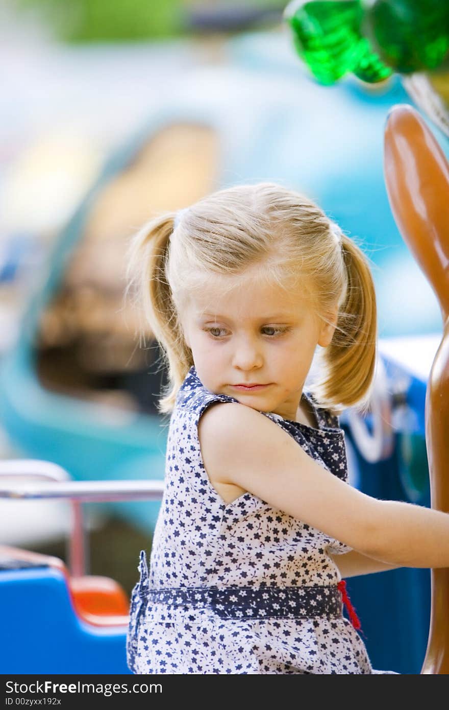 Little cute girl having fun in park