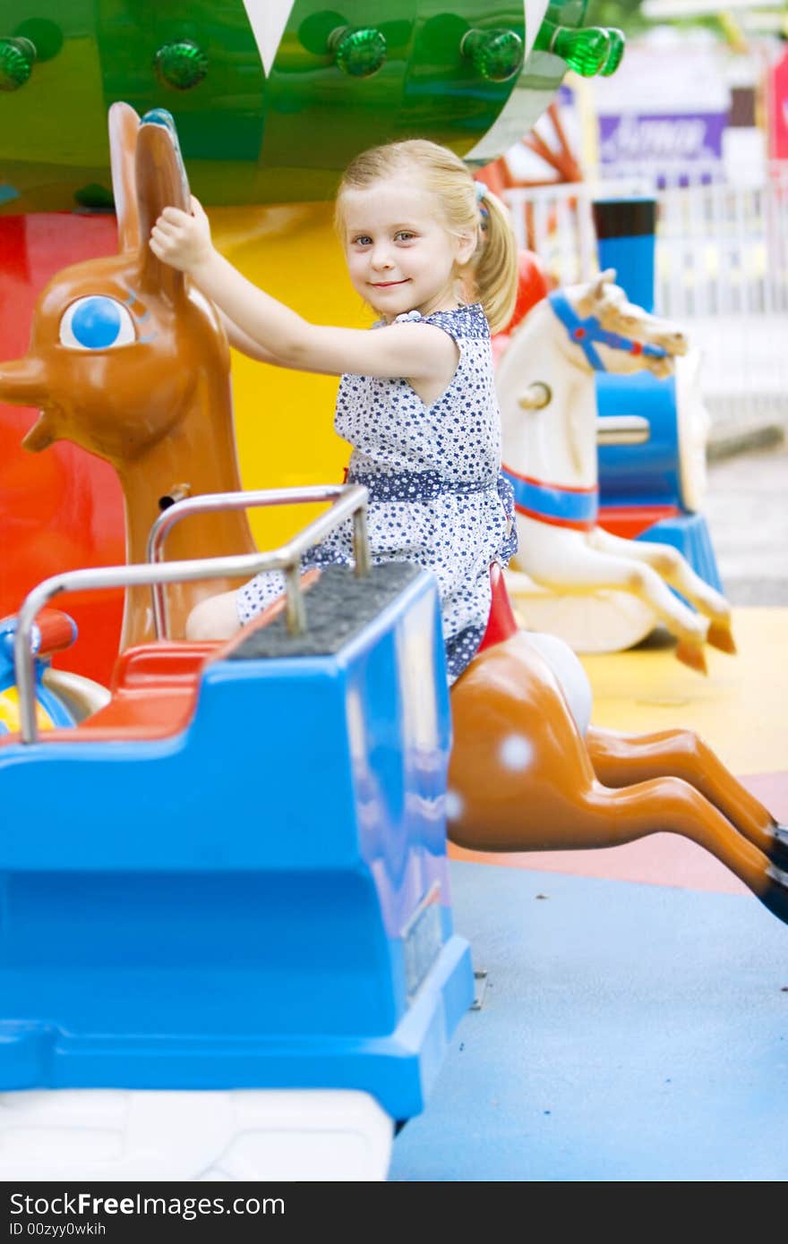 Little cute girl having fun in park