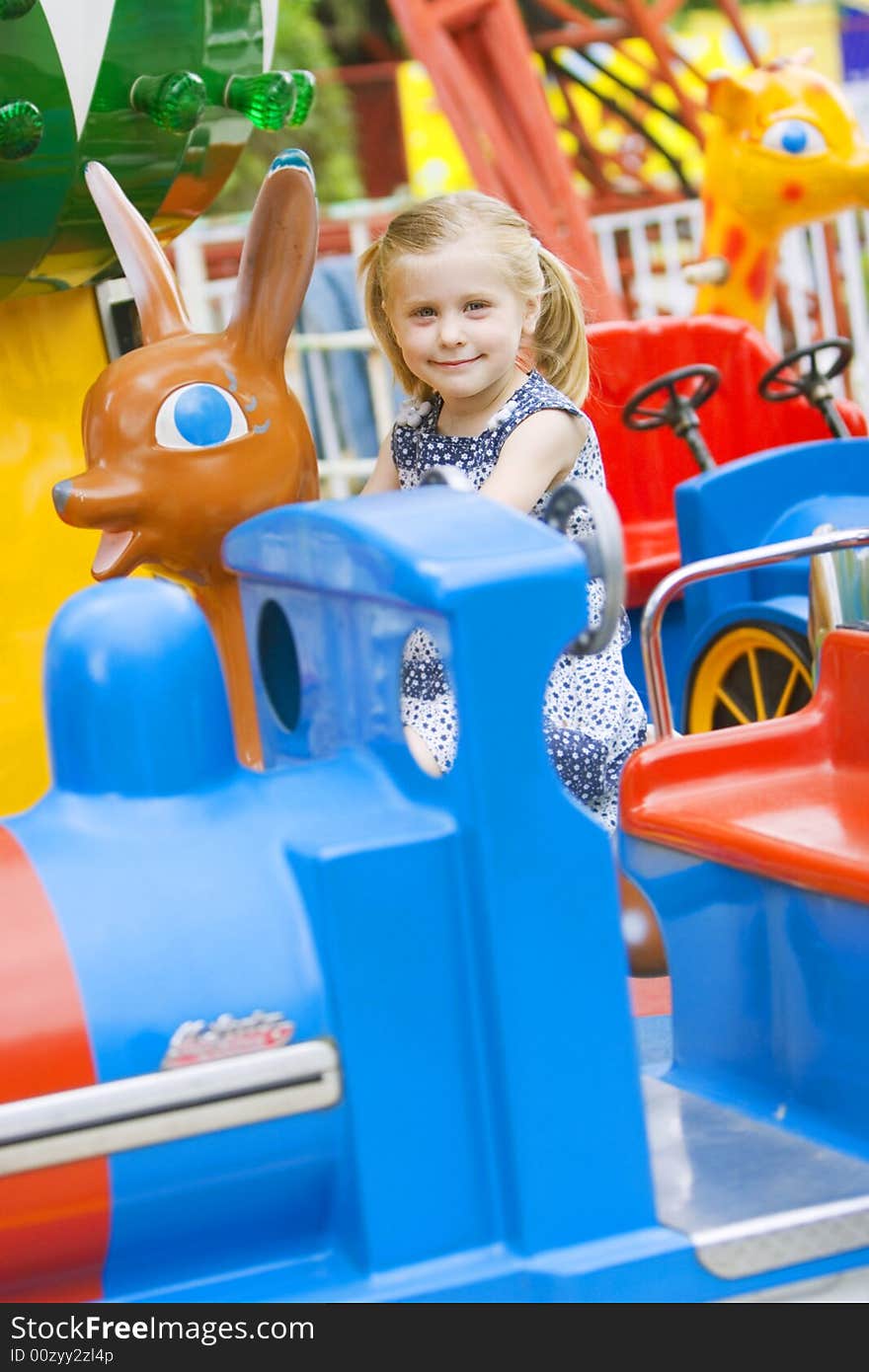 Little cute girl having fun in park