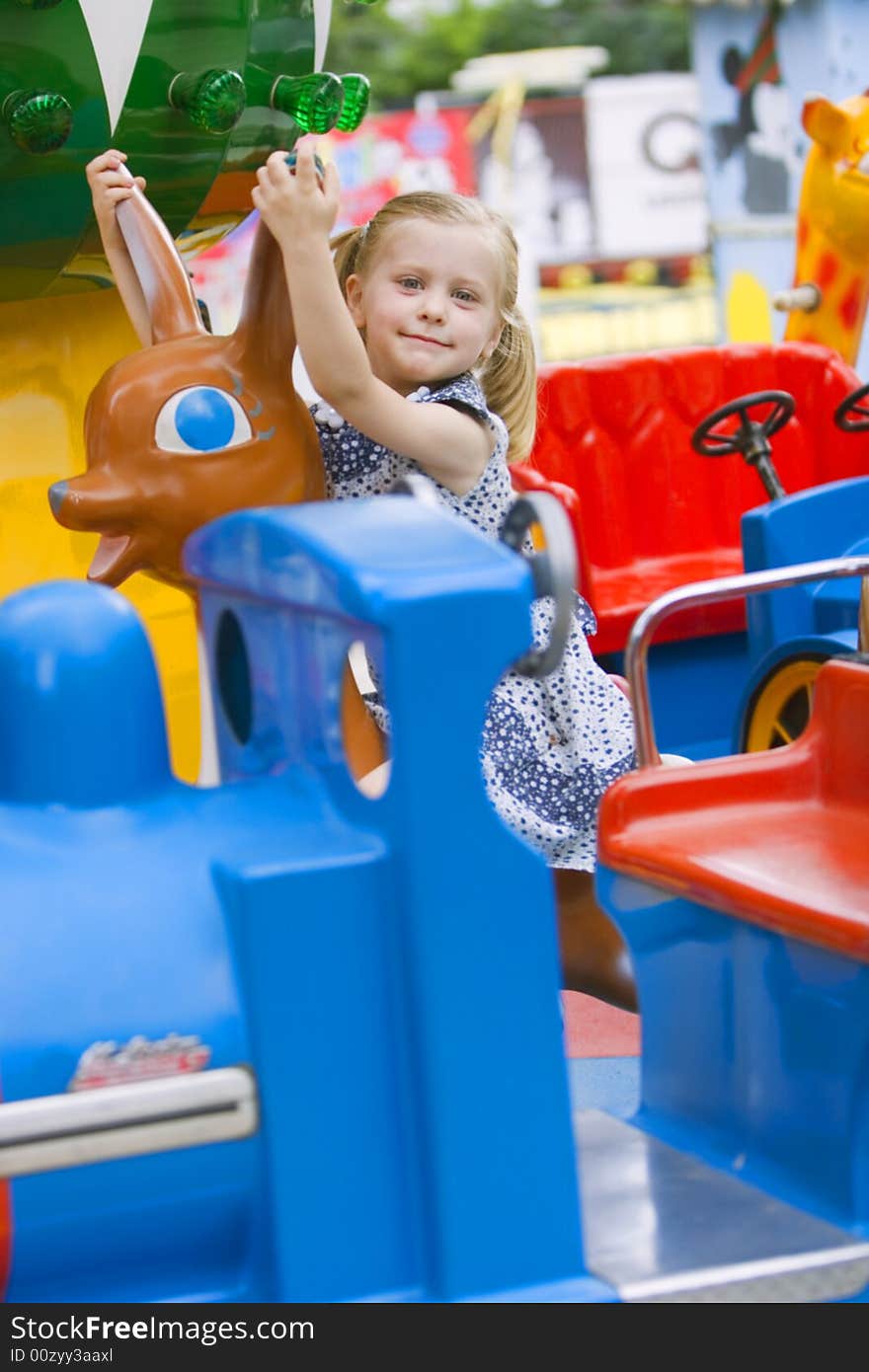 Little cute girl having fun in park