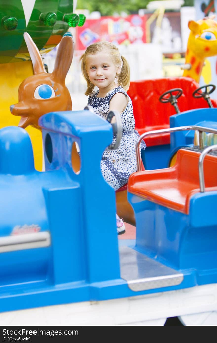 Little cute girl having fun in park