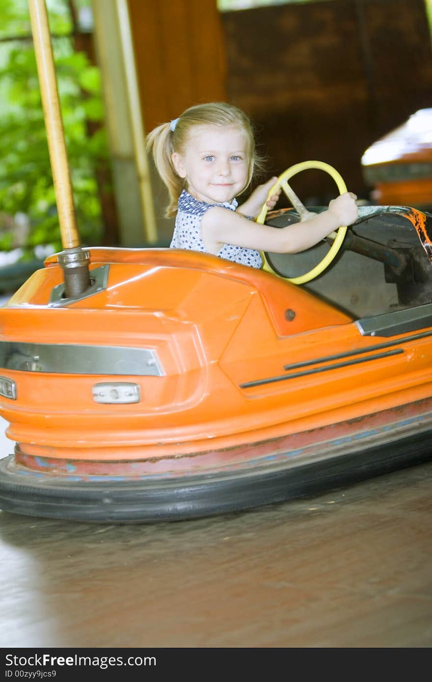 Little cute girl having fun in park