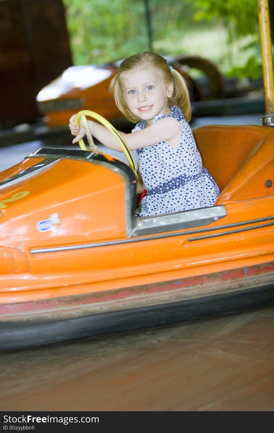 Little cute girl having fun in park