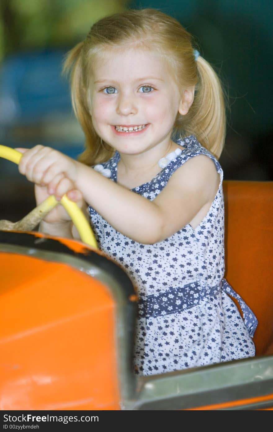 Little cute girl having fun in park