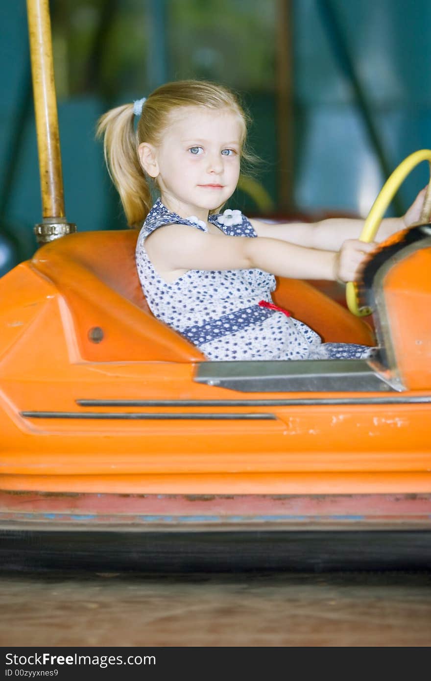 Little cute girl having fun in park