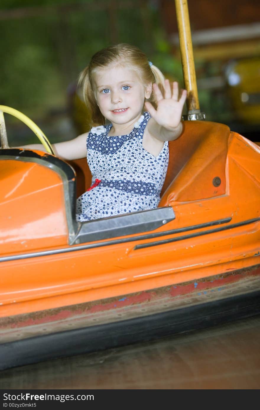 Little cute girl having fun in park