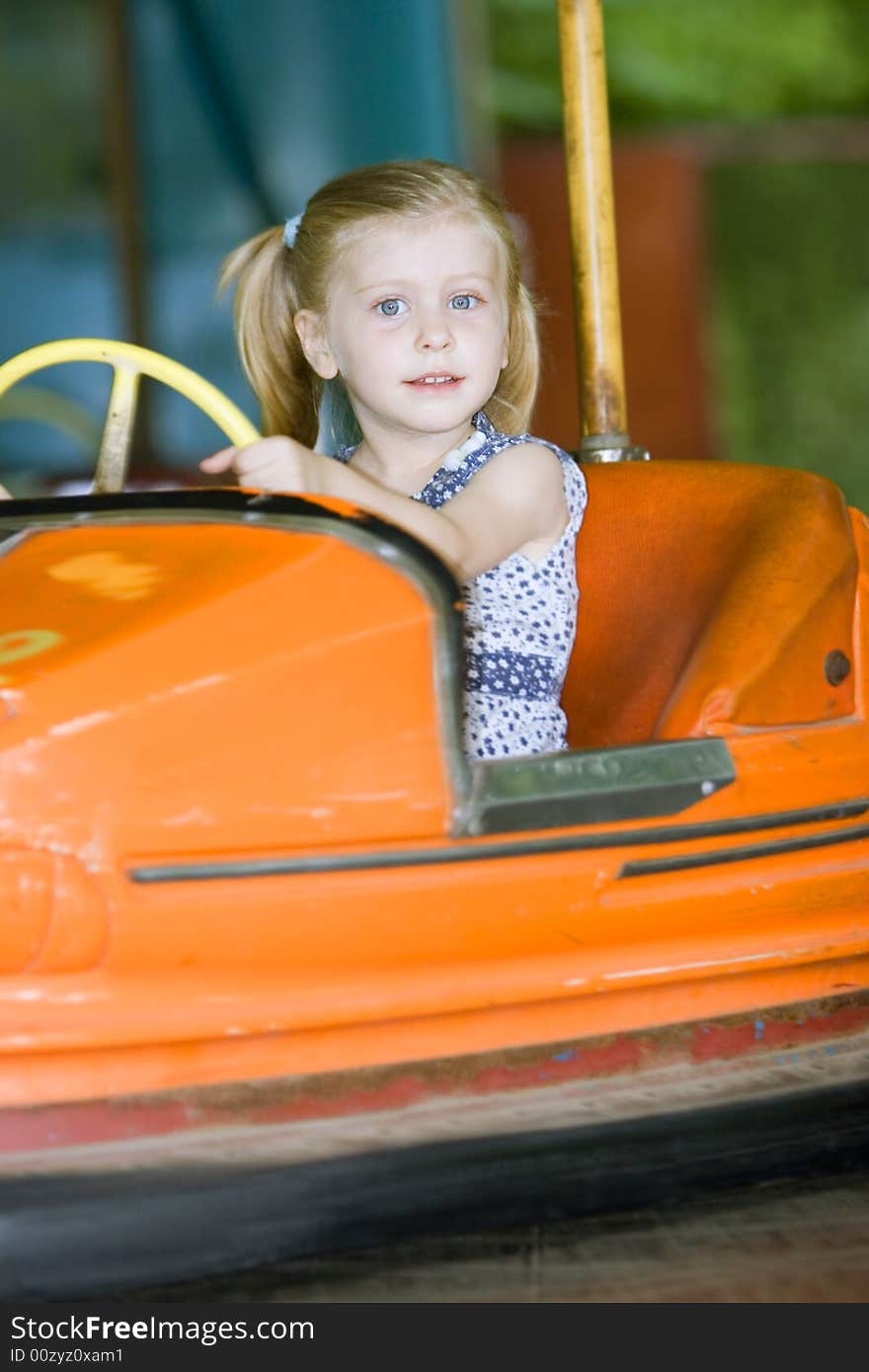 Little cute girl having fun in park