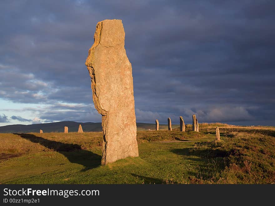 Ring of Brodgar in dramatic evening light and cloudscape. Ring of Brodgar in dramatic evening light and cloudscape