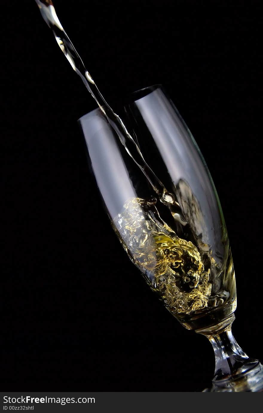 Glass of drink poured on black background. Glass of drink poured on black background