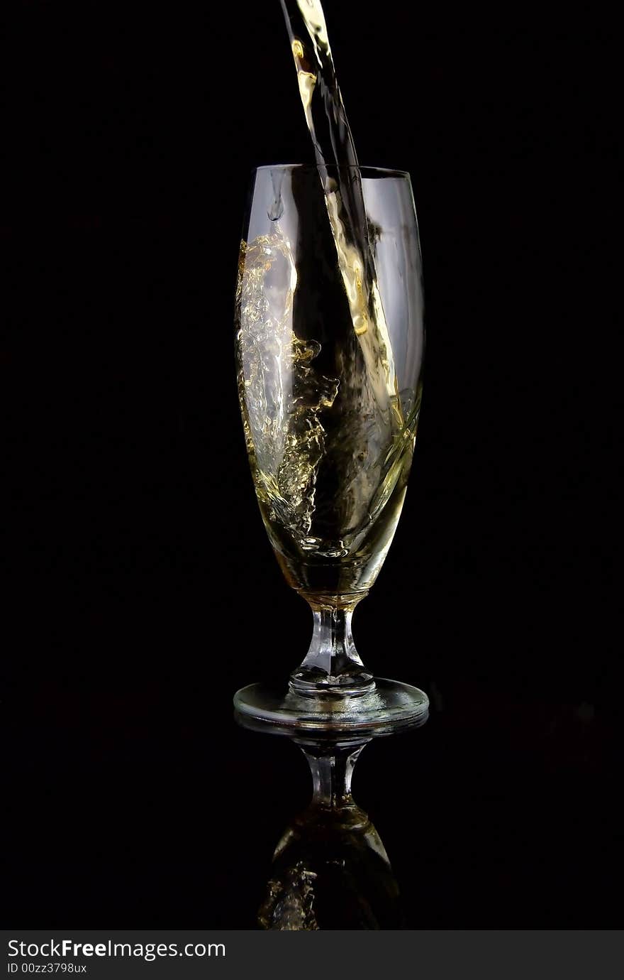 Glass of drink poured on black background. Glass of drink poured on black background