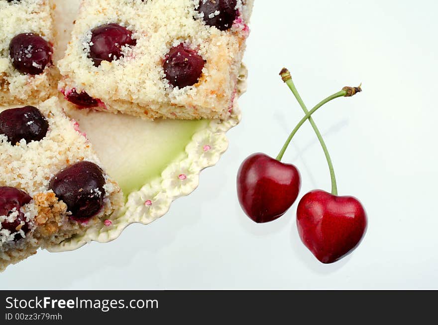 Homemade shortcake with cherries on white background. Homemade shortcake with cherries on white background