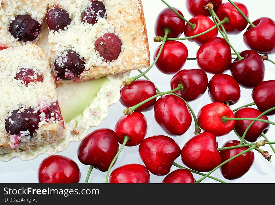 Homemade shortcake with cherries on white background. Homemade shortcake with cherries on white background