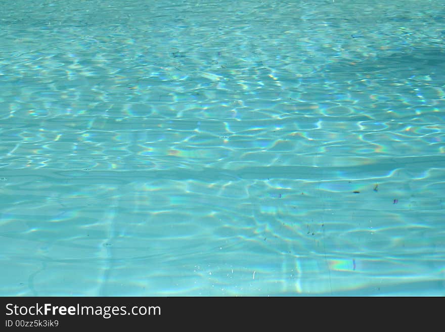 Swimming pool with reflection of the sun in the water. Swimming pool with reflection of the sun in the water