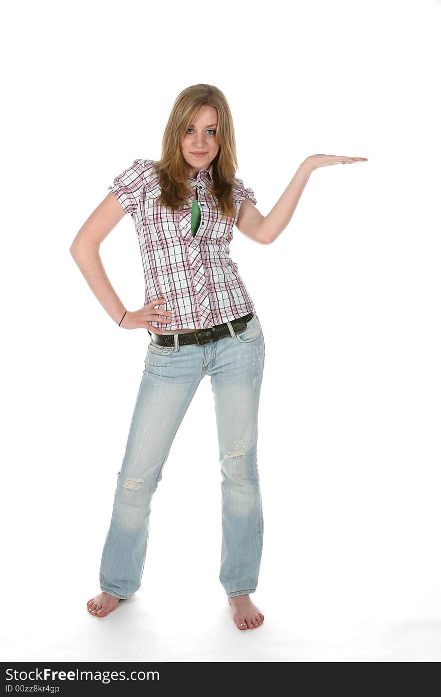 Teenage girl with hand out and palm up for product placement, looking at camera. Teenage girl with hand out and palm up for product placement, looking at camera