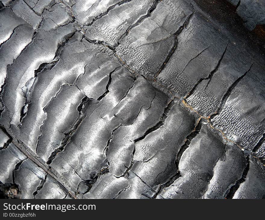 A close up photograph of some brunt tree bark. A close up photograph of some brunt tree bark.