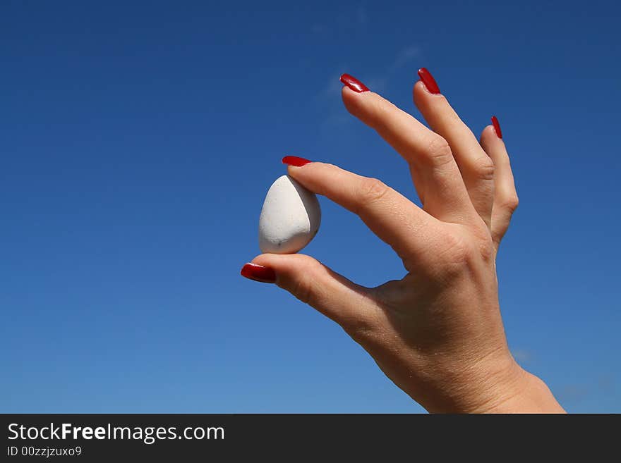 Holding white stone