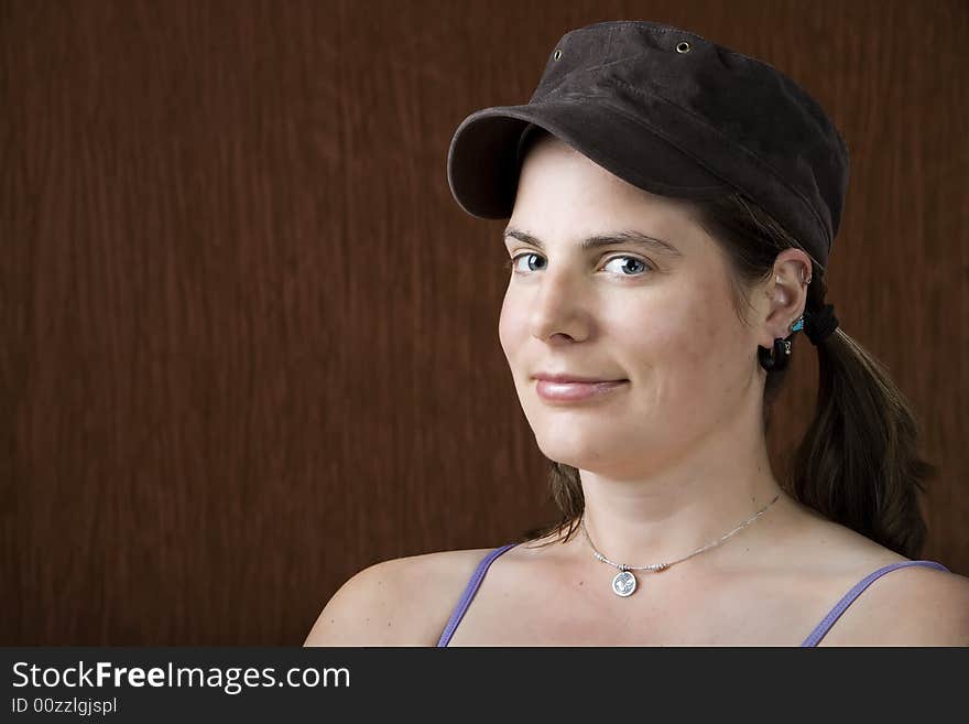 Closeup of woman with blue eyes wearing a cap