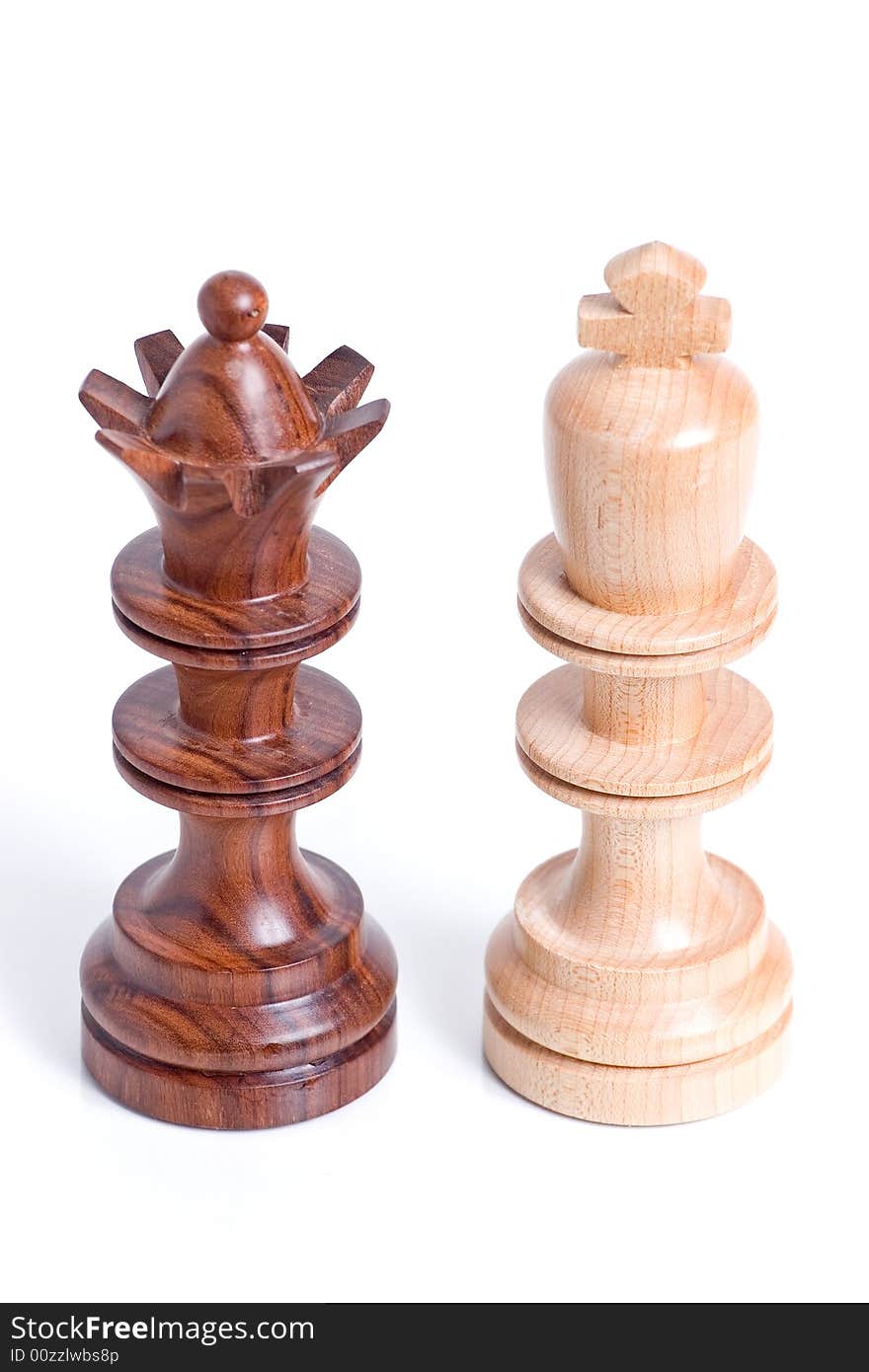 Two chess pieces standing beside each other.