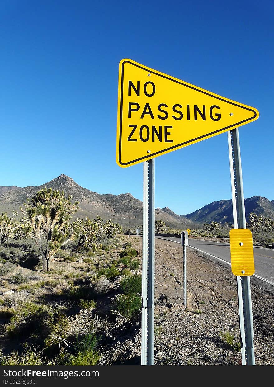 Road Sign Posted Along Street - Vertical