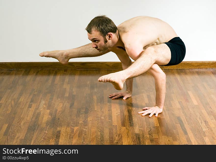 Man in a Yoga Crouch - Horizontal