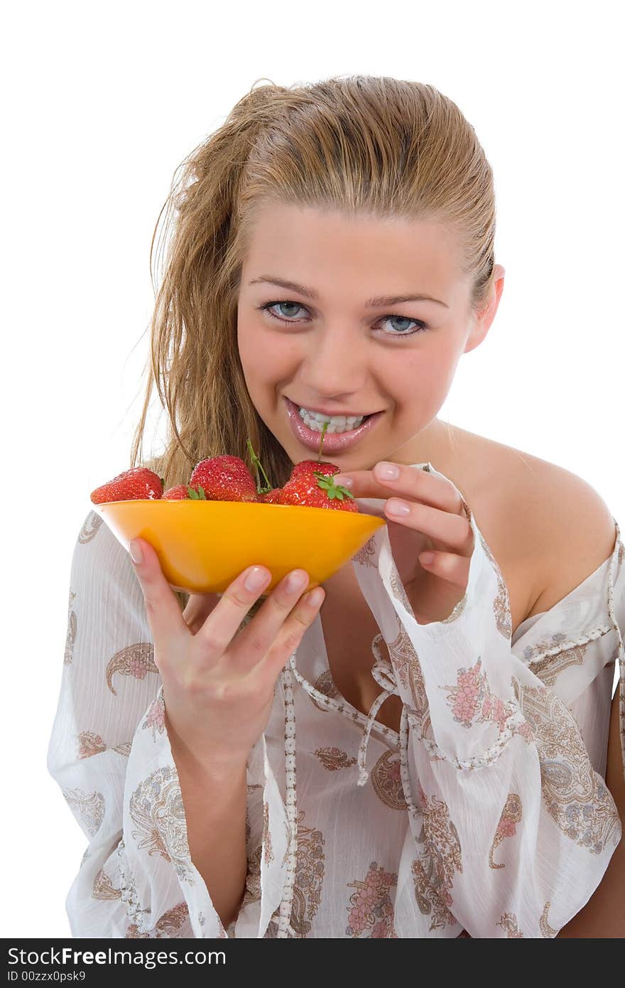 Beautiful girl with strawberry over white