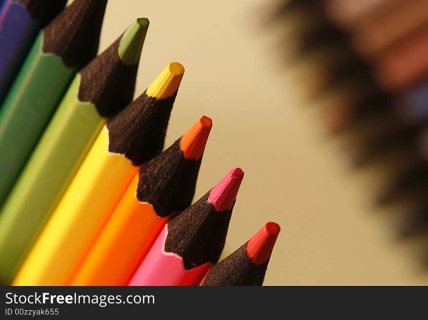 Colurs pencils in a simple colorful background