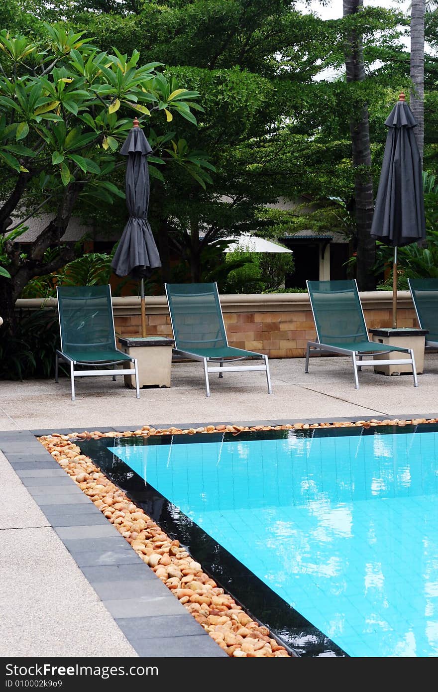 Swimming pool scene at a tropical resort.