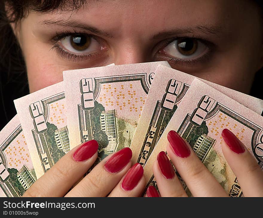 Beautiful lady holds dollars like a feather. Beautiful lady holds dollars like a feather.