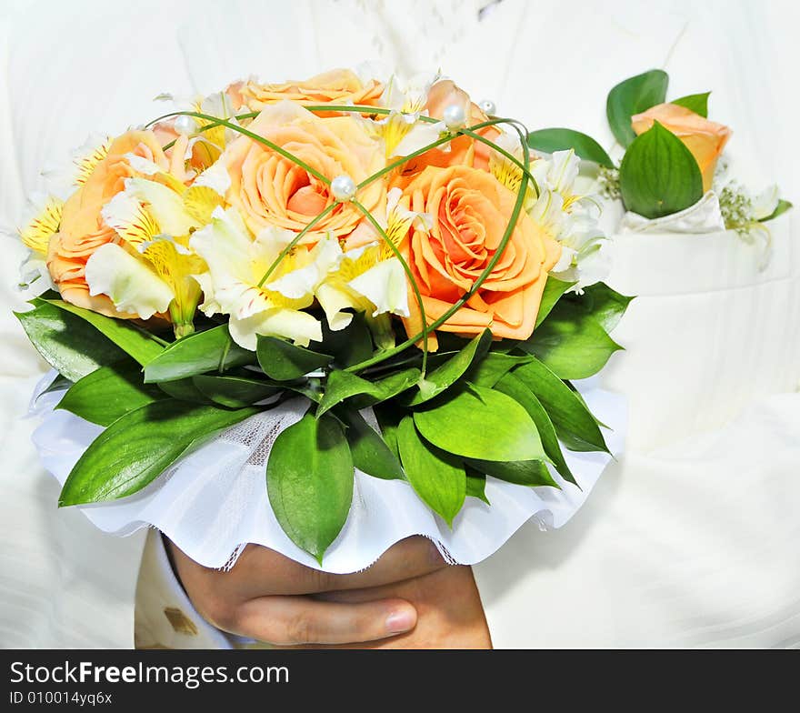 Groom in luxurious wedding suit with wedding bouquet. Groom in luxurious wedding suit with wedding bouquet