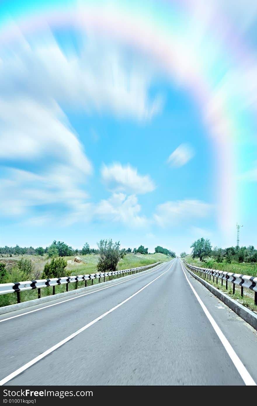 Abstract rainbow on Car road on background sky and cloud