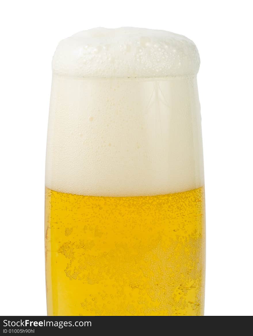 Fresh foamy beer in a glass on a white background.