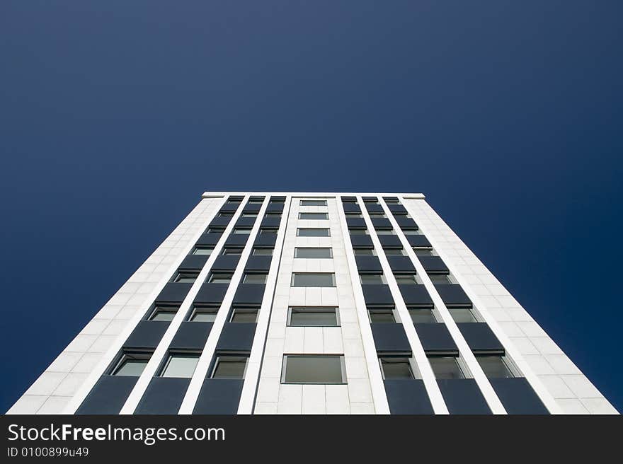 A skyscraper in the blue sky